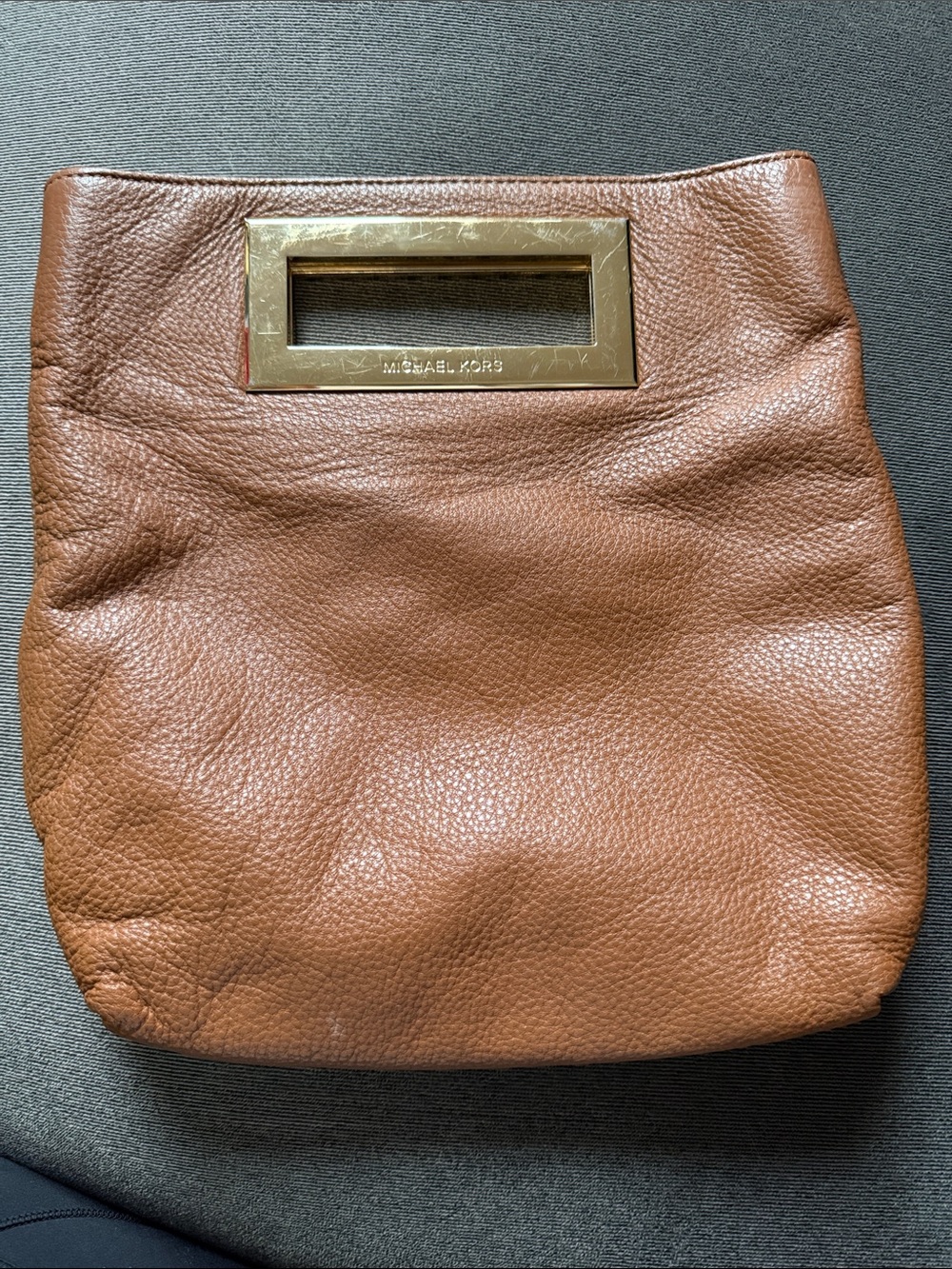 Michael Kors brown leather clutch purse with gold tone open handle